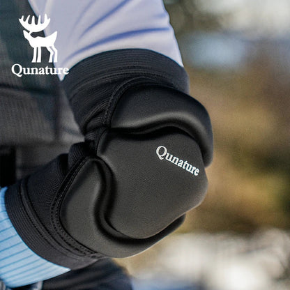 A person wearing a pair of black elbow pads